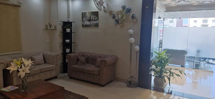 Patient waiting area at Happy Smile Designers dental clinic